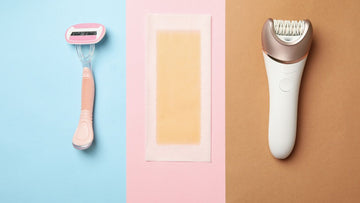 Razor, epilator, and wax strips on blue and pink background.