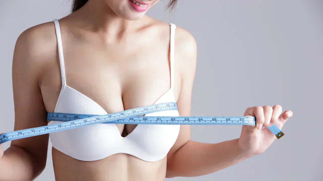 Image of a women measuring her bust