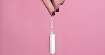Hand holding a tampons