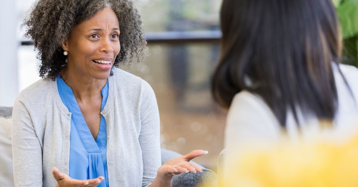 Image of parent mom talking with her daughter