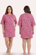 A plus-size model is shown from the front and back wearing a pink hearts pattern.