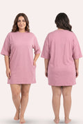 Pink dress worn by a model on a white background
