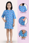 A girl wearing a blue floral nightgown with three circular inset detail views.