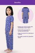 Girls wearing navy hearts pajamas with a pattern, standing next to an inset image of the pajamas