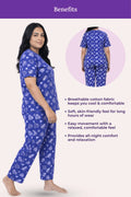 Woman wearing a navy hearts pajama set with text highlighting benefits