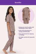 Teen wearing a brown leopard print pajama set with product details