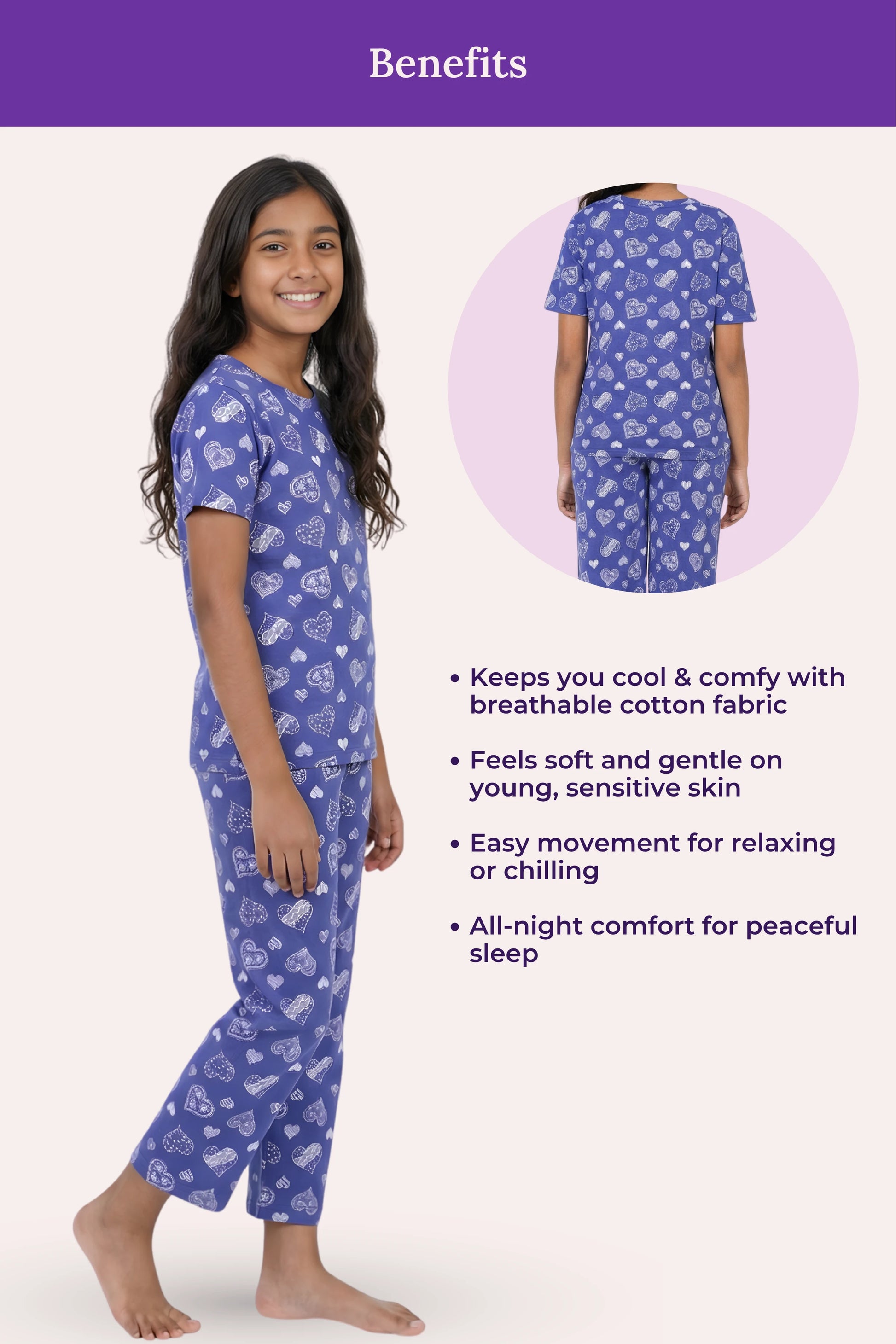 Teen wearing blue pajamas with a navy heart pattern, standing against