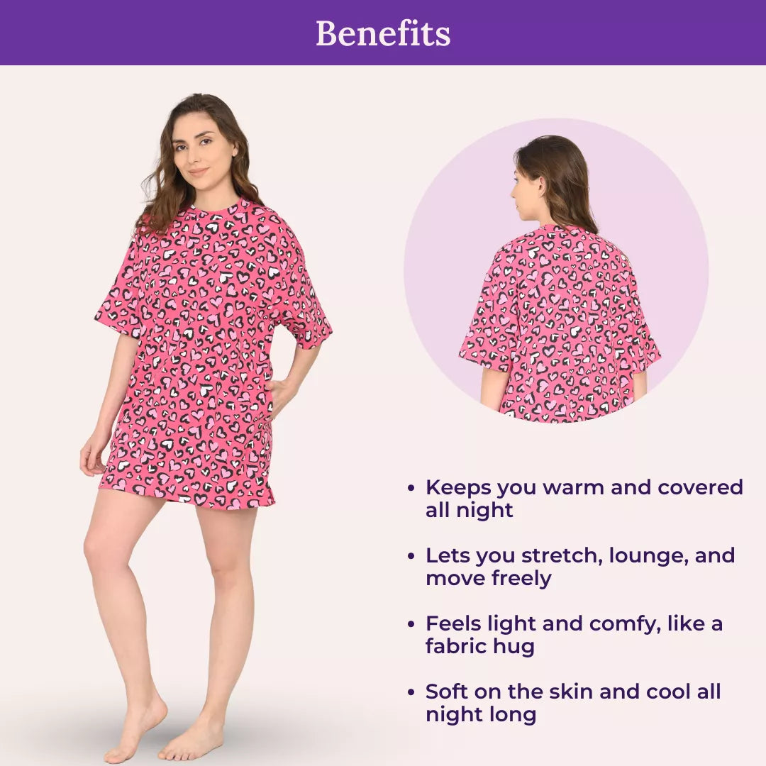 Woman wearing a candy heart oversize t shirt with text listing benefits