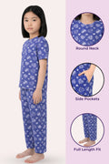 Girls wearing a navy pajama set with heart patterns, shown from different angles