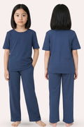 Girl wearing a airforce navy pajama set, shown from front and back