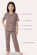 Girl wearing a brown leopard print pajama set with labeled features