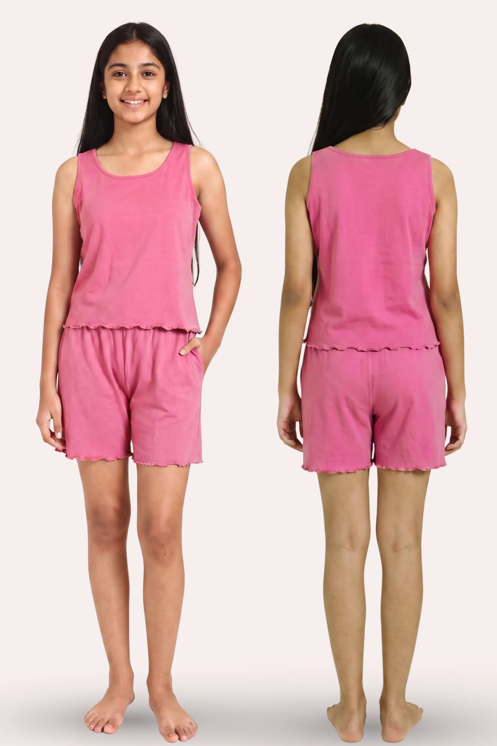 A young girl modeling a pink sleeveless top and matching shorts set, shown from both the front and back views against a plain light background.
