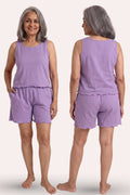 A woman modeling a sleeveless lavender-purple two-piece lounge set, shown from both the front and back views against a solid light beige background.