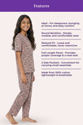 Teen wearing a brown leopard print pajama set with product features listed