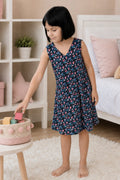 A girl wearing a sleeveless V-neck nightgown with black color.