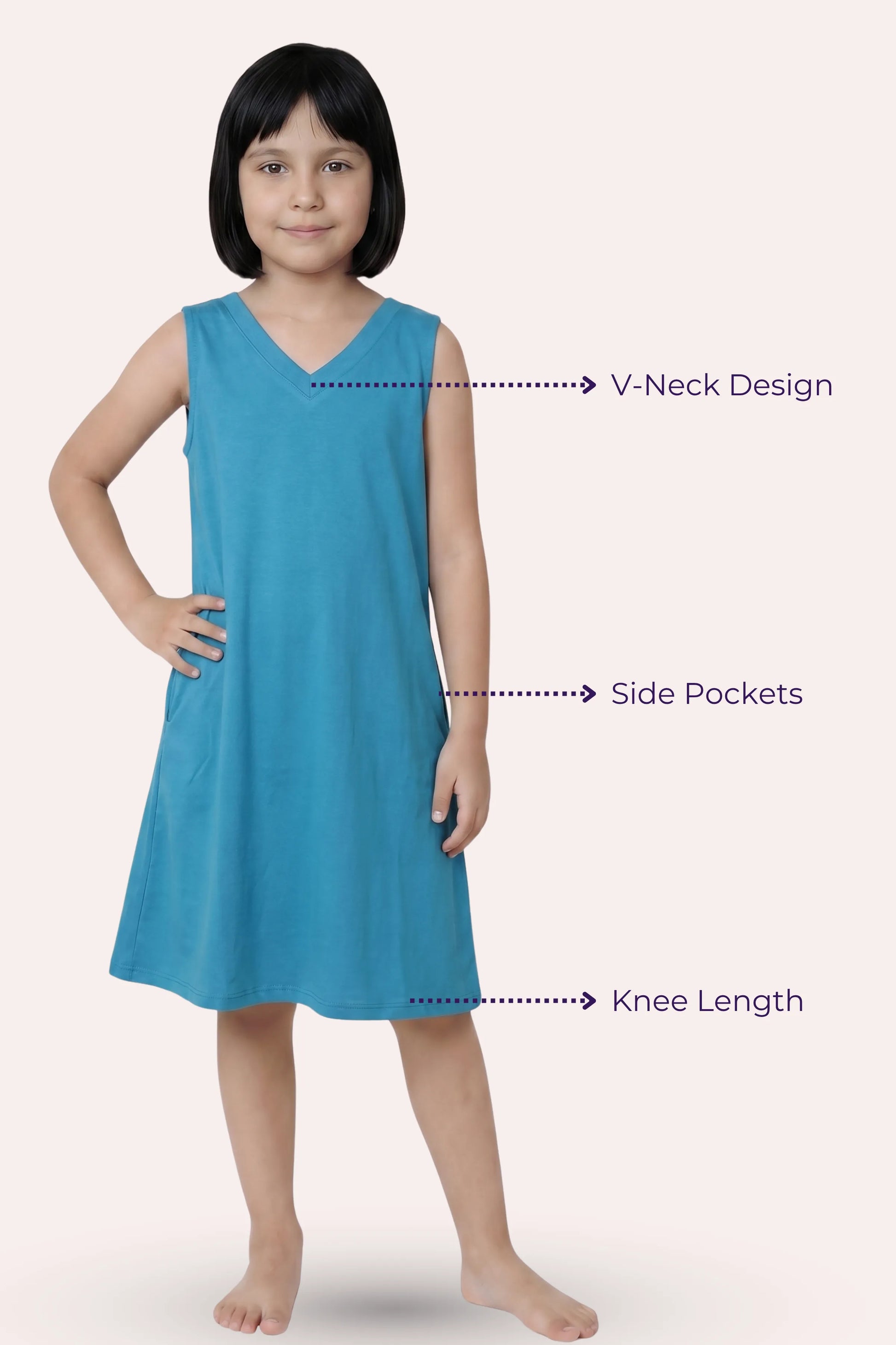 A girl model wearing a sleeveless peacock blue dress with a V-neck, side pockets, and knee-length.