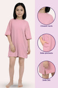 A girl wearing a light pink dress, with three circular detail callouts on the right highlight a closed neck, side pockets, and a side slit.