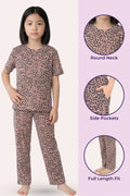 Girl wearing brown leopard print pajama set with product details