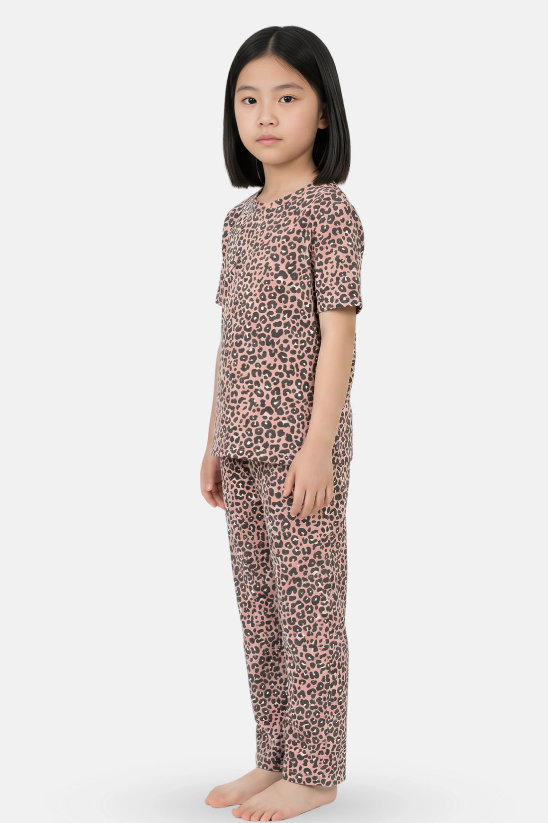 Girl wearing a brown leopard print pajama set 