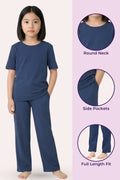 Girls wearing a airforce navy outfit with round neck, side pockets, and full length fit