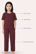 Girl wearing a wine outfit with labeled features