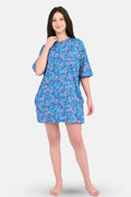 Woman wearing a blue floral dress on a white background