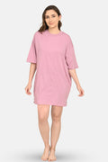 Woman wearing a purple dress on a white background