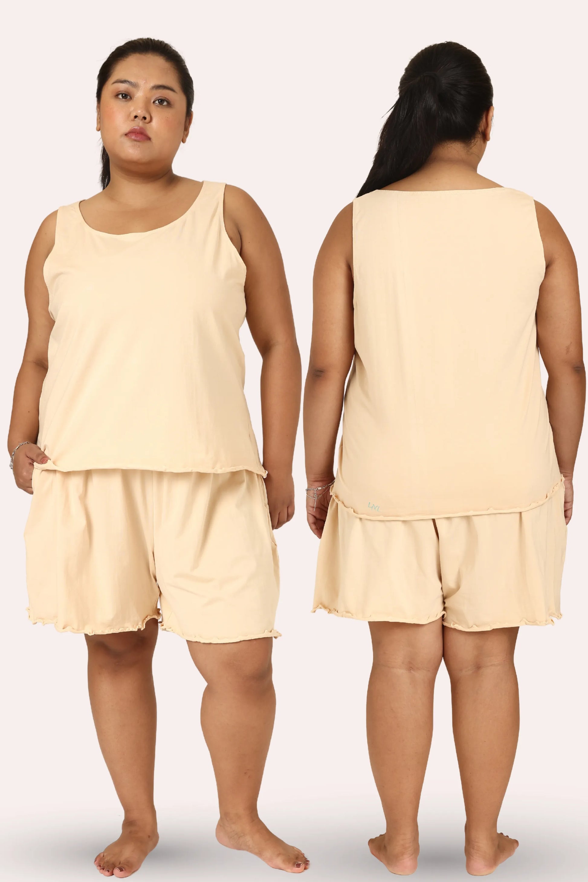 Curvy woman wearing a cream sleeveless top and shorts set, shown from front and back