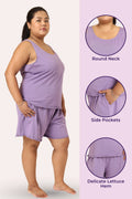 Curvy woman wearing a lavender outfit with round neck, side pockets, and delicate lettuce hem details