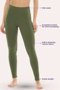 Green leggings with text labels on a white background