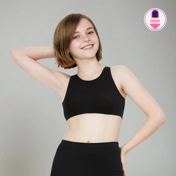 Image of teen wearing a black non padded starter bra on a gray background - Click to Know More.