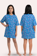 A young girl modeling a blue floral pattern, shown from both the front and back views.