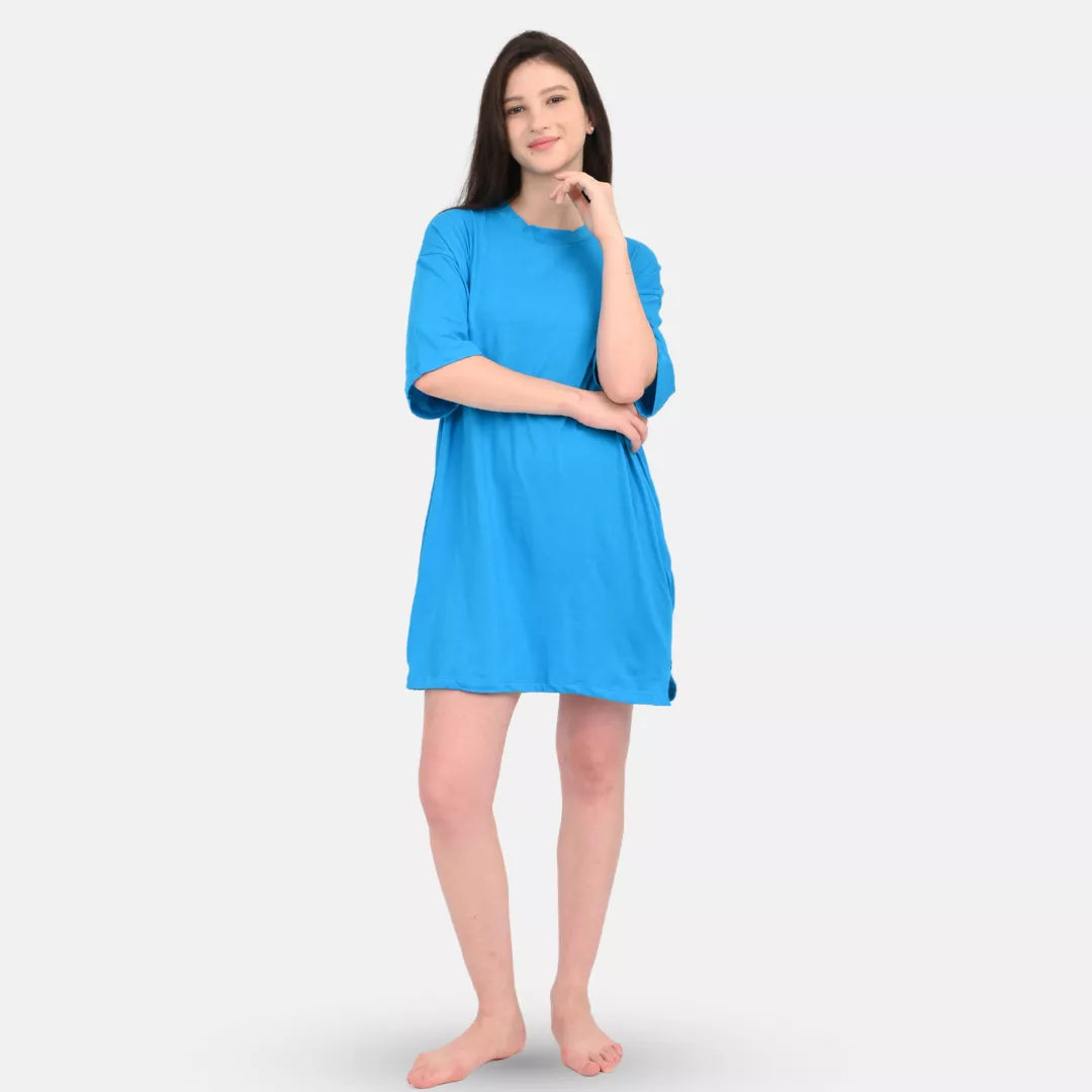 Woman wearing a over sized t-shirt blue dress