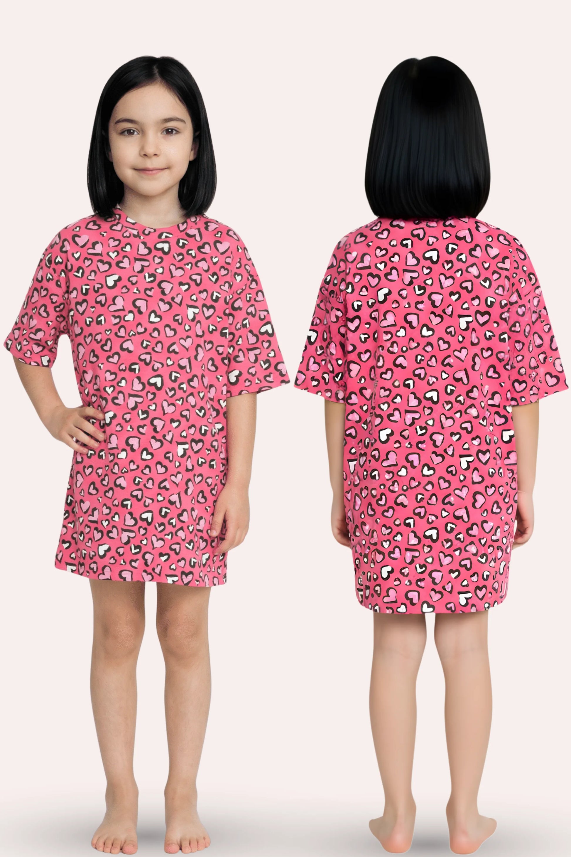 A girl modeling a pink nightgown with a hearts print, shown from both the front and back views.