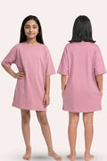 Pink nightgown worn by a model on a white background