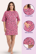 A woman model a pink t-shirt with side pockets, shown next three circular detail.