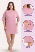 Pink nightshirt with closed neck, side pockets, and side slit.