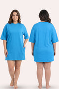 A plus-size model is shown from the front and back view wearing a bright blue t-shirt dress.