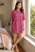 A woman wearing a candy hearts aop patterned nightshirt