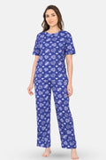 Woman wearing a navy hearts pajama set