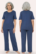 Woman wearing a airforce navy pajama set, shown from front and back