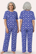 Woman wearing a navy hearts pajama set with white patterns, shown from front and back