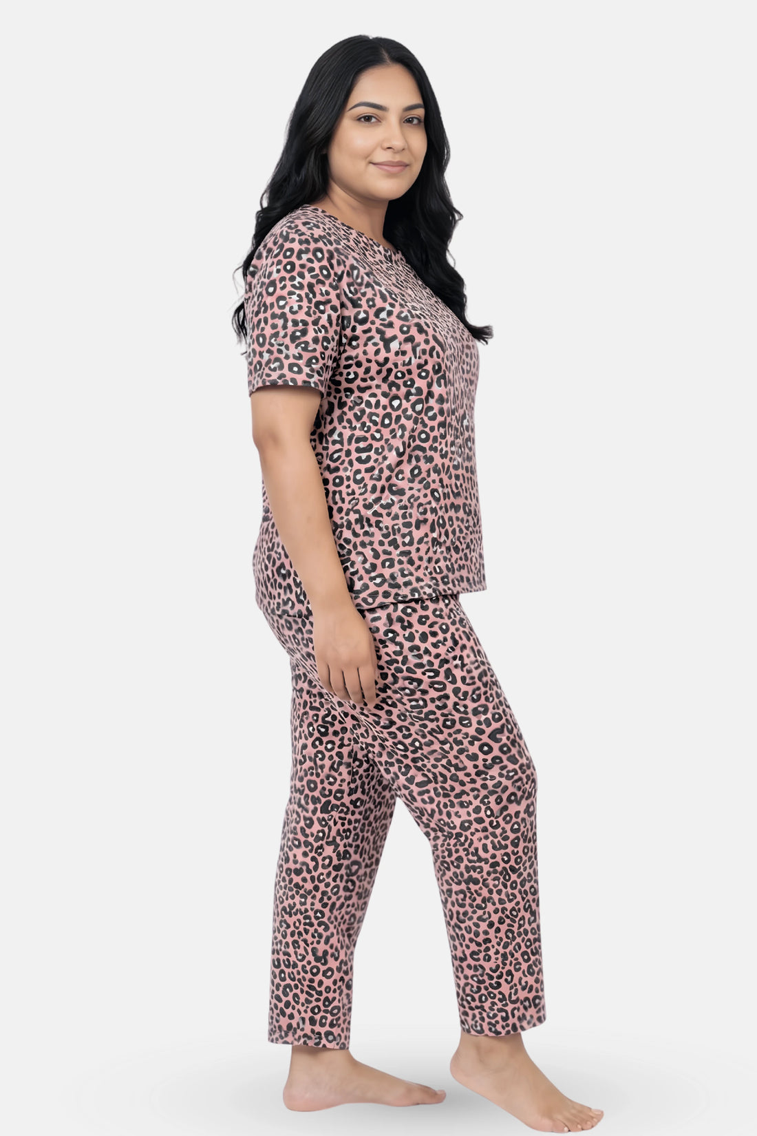 Woman wearing a brown leopard print pajama set