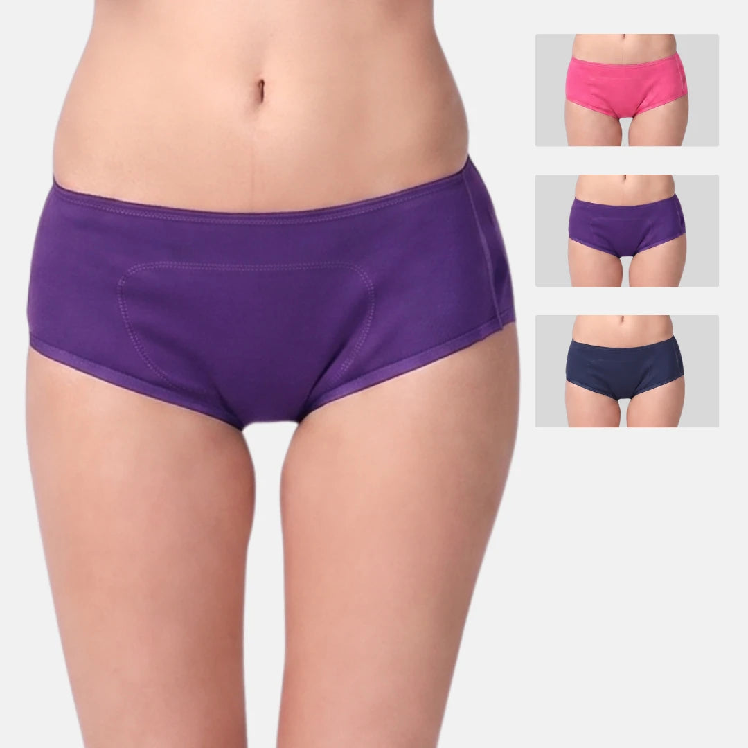 A model is wearing purple teen's boxer, with three smaller inset images on the right showing the same underwear in pink, purple, and navy.
