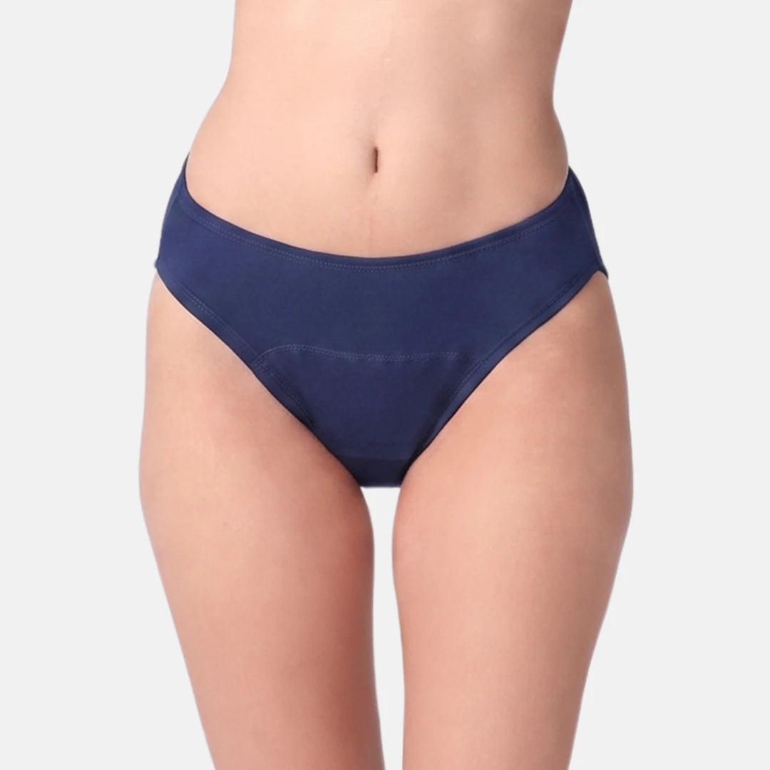 A model wearing a pair of navy blue hipster against a light gray background.