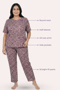 Woman wearing a brown leopard print pajama set with labeled features