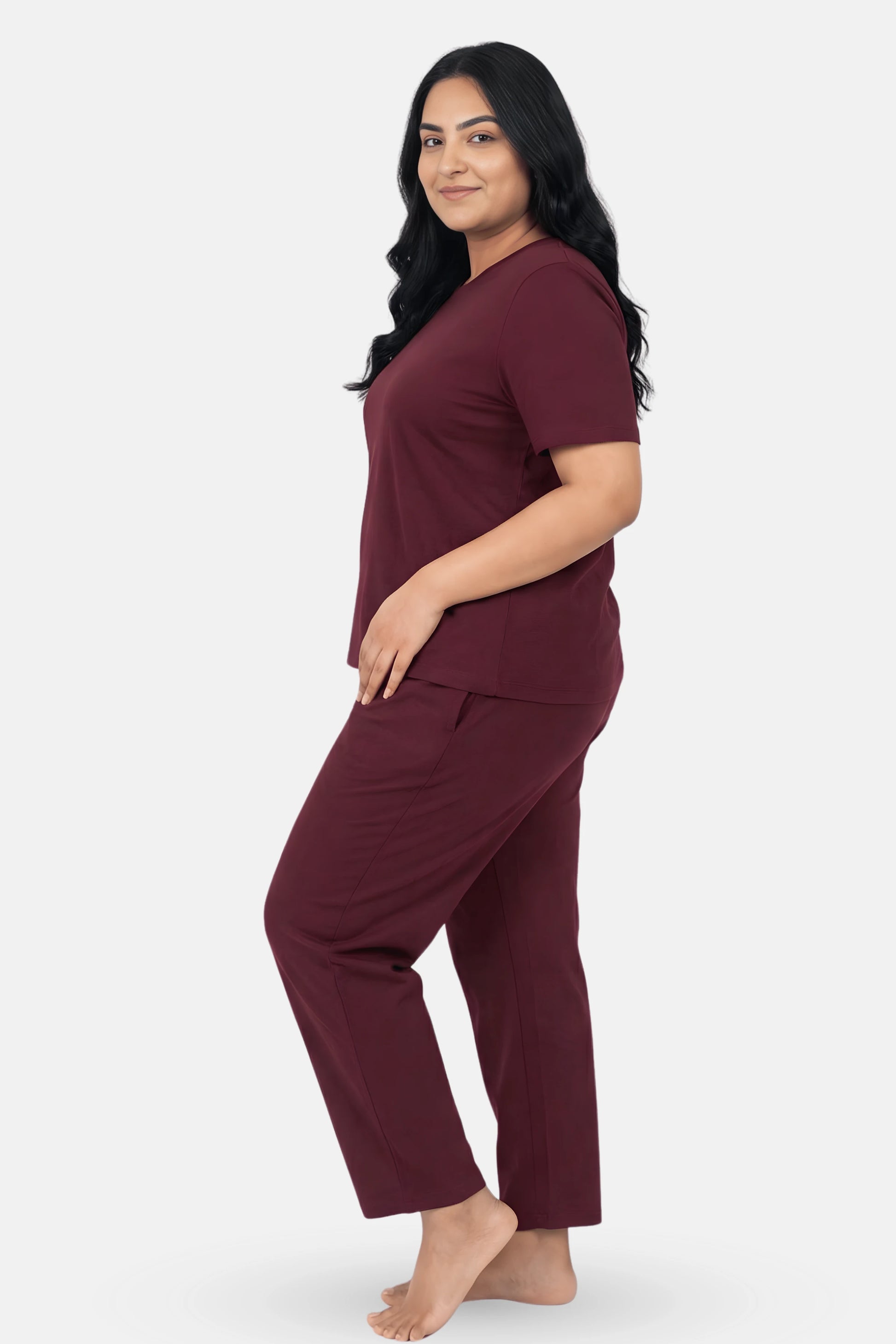 Woman wearing a wine pajama set