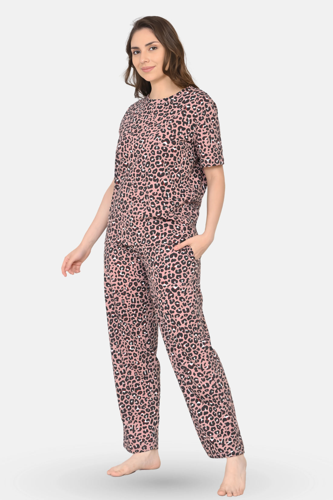 Woman wearing a brown leopard print pajama set