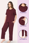 Woman wearing a wine pajama set with highlighted features
