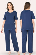 Woman wearing a airforce navy pajama set, shown from front and back views